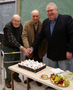 Celebrating RASC Victoria Centre's 90th anniversary in 2004 - George Ball, John Climenhaga and Chris Gainor cut the cake.