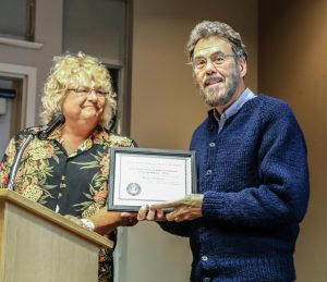 Jim Stillburn receives the Ernie Pfannenschmidt Award in Amateur Telescope Making from Sherry Buttnor for building his Poncet Telescope tracking system