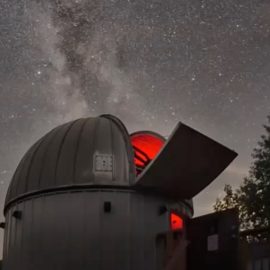 Black Nuggest Lake Observatory under a dark sky