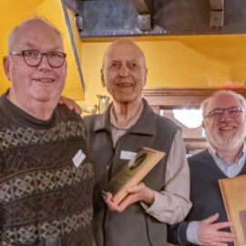 Sid Sidhu receiving the Newton-Ball Service award in 2025 from Chris Gainor and Randy Enkin